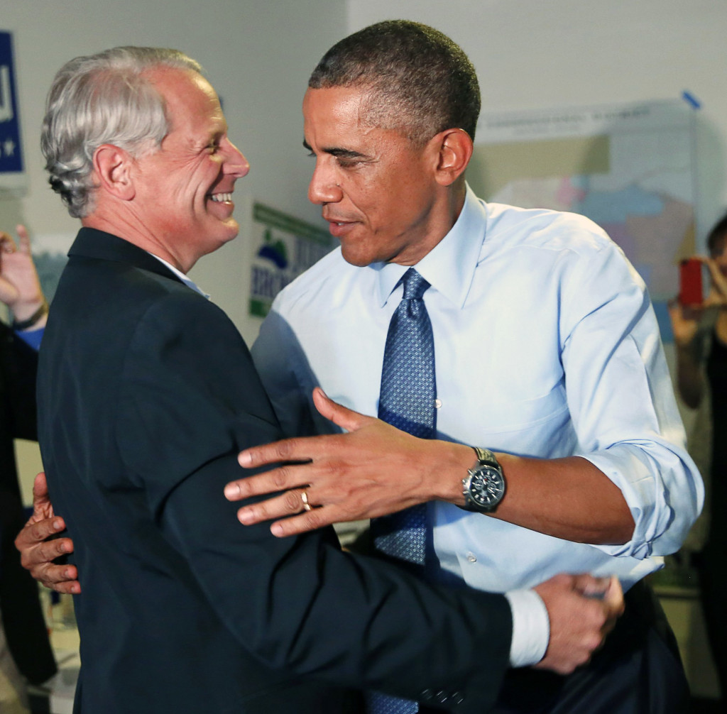 U.S. President Barack Obama hugs Democratic Congressional Campaign Committee Chairman Steve Israel during a visit in California